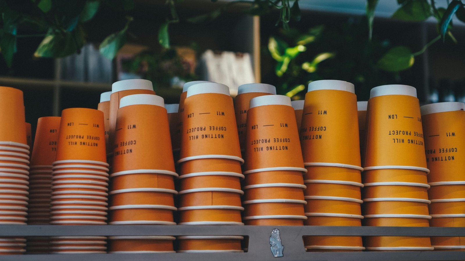 Stacks of custom-printed paper cups ready for delivery