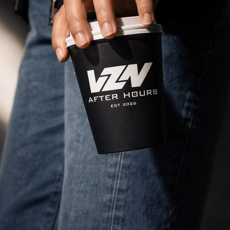 A custom-printed coffee cup held in hand